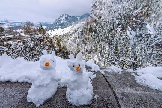 Snowmen in the surroundings at Linderhof Palace, during the German winter, in southwest Bavaria near the village of Ettal. Bavaria, Germany, 2018
