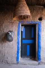 Beautiful blue entrance door in a traditional berber house in the mountains of  the Ourika Valley...