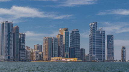 Fototapeta premium Sharjah city view, high rise buildings with lagoon
