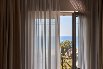 Apartment with sea view, open balcony door