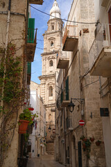 one of the charming narrow street of picturesque Monopoli old town, Puglia, Italy