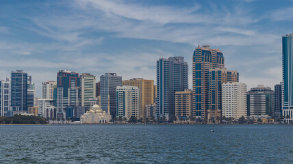 Fototapeta premium Sharjah city view, high rise buildings with lagoon