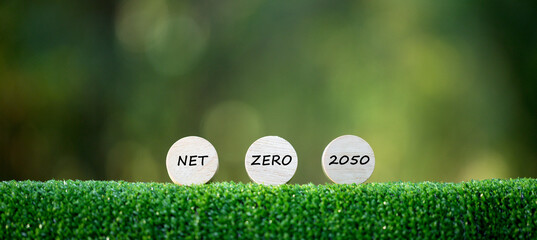Net Zero and Carbon Neutral Concepts Net Zero Emissions Goals A climate-neutral long-term strategy Ready to put wooden blocks by green net center icon and green icon on bokeh background. - obrazy, fototapety, plakaty