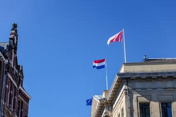 Fototapeta na wymiar Utrecht, Netherlands - April 2, 2023: Regional and national flags of the Netherlands and the EU in old town Utrecht 