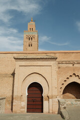 Fototapeta na wymiar Moroccan mosque and moorish arch and door design in the city of Marrakech