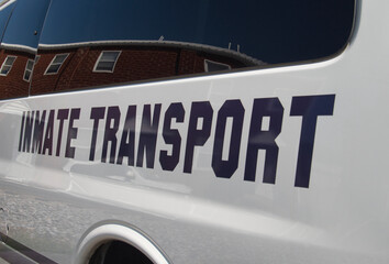 Inmate transport sign on side of van 
