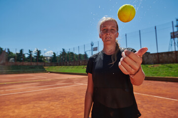Before her training, the tennis player joyfully playing with a tennis ball, radiating enthusiasm...