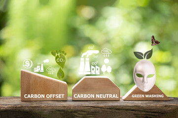 Carbon offset ,carbon neutral,green washing word on wood and icon concept for environmental in...