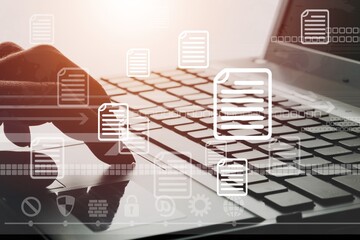 Document Management concept. Hands on laptop computer