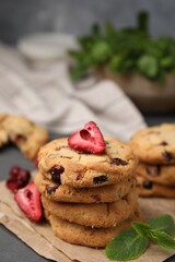 Cookies with freeze dried fruits and mint on grey table, closeup
