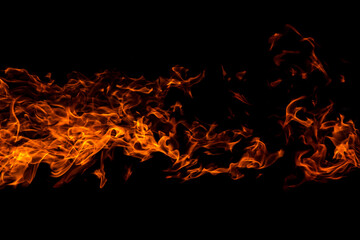 Fototapeta na wymiar Horizontal Fire flame against black background, abstract texture, copyspace