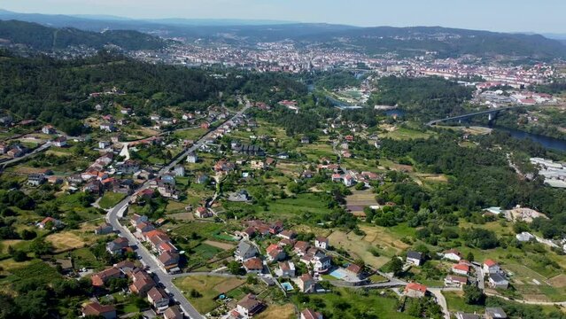 Idyllic spanish town of velle in countryside fronting ourense spain, aerial overview