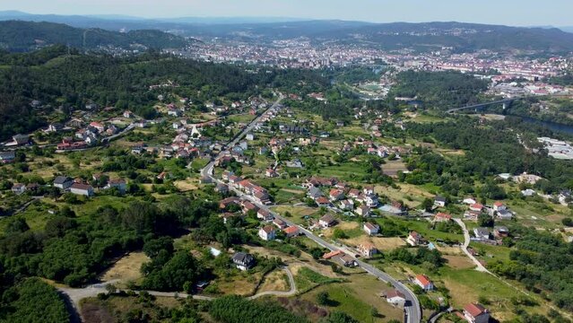 Aerial panoramic overview of Ourense and Velle nestled in forest of Spain