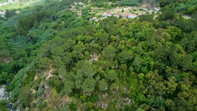 Santome archeological ruins nestled in forest above ourense galicia spain, aerial
