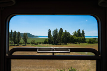 View from an old train to lake Balaton on a summer day, Go to a vacation, school trip