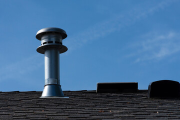 An image of a single vent stack on a residential roof top. 