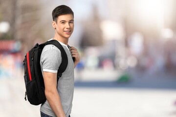 Happy young man student, near the college