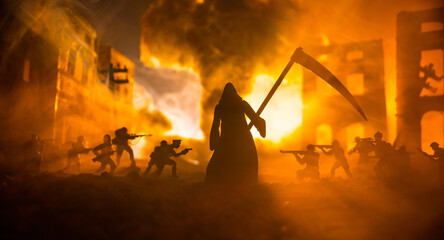 Concept of death soldiers during the war. Grim reaper (Skeleton) holding schyte with military...