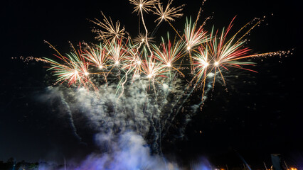 fireworks on a black background Frame or border from golden sparks and firecrackers isolated on new year night fireworks and bokeh lights on dark blue night sky background.