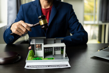 Consultation, contract agreement, lawyer focused on court hammer sitting on chair with client's...