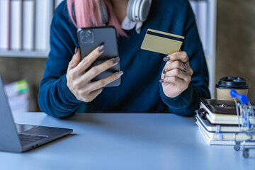 Woman shopping online on smartphone with credit card pay online Buy online, pay via internet banking