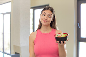 young pretty woman smiling and looking with a happy confident expression. japanese ramen concept