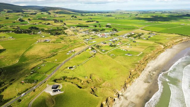 Gemstone beach near orepuki town in New Zealand, aerial view in golden hour