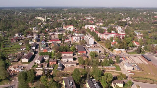 A small border town in Latvia. Valka city at sunset. Drone flight over the city