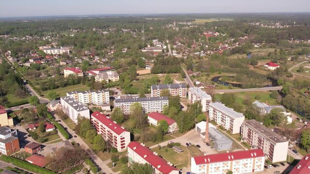 A small border town in Latvia. Valka city at sunset. Drone flight over the city