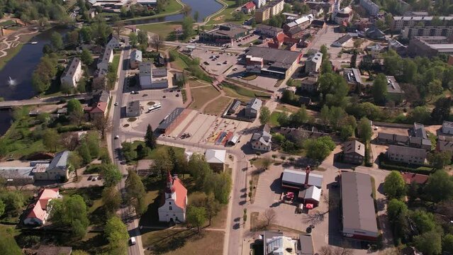 A small border town in Latvia. Valka city at sunset. Drone flight over the city