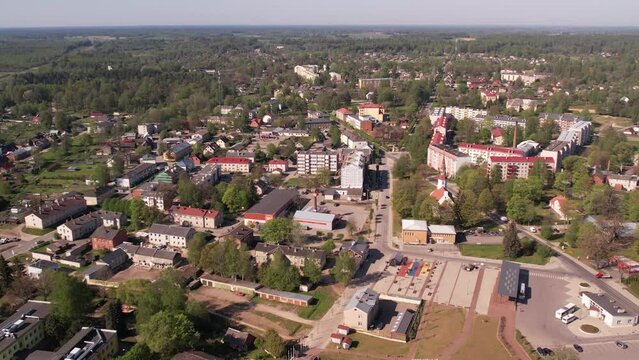 A small border town in Latvia. Valka city at sunset. Drone flight over the city