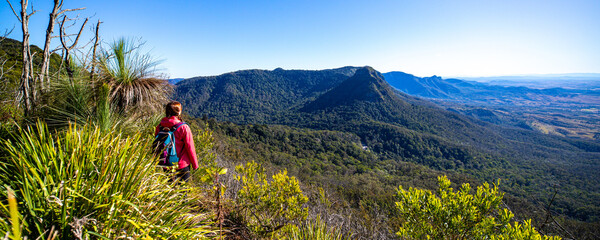 A backpacker girl enjoys the view from the top of Mount Mitchell after a successful hike, Main...