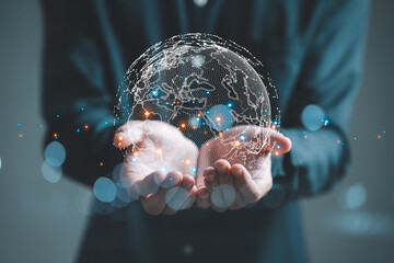 Businessman holding Global network connection.  World map point and line composition concept of global business.Digital link tech. Big data analytics and business intelligence concept.