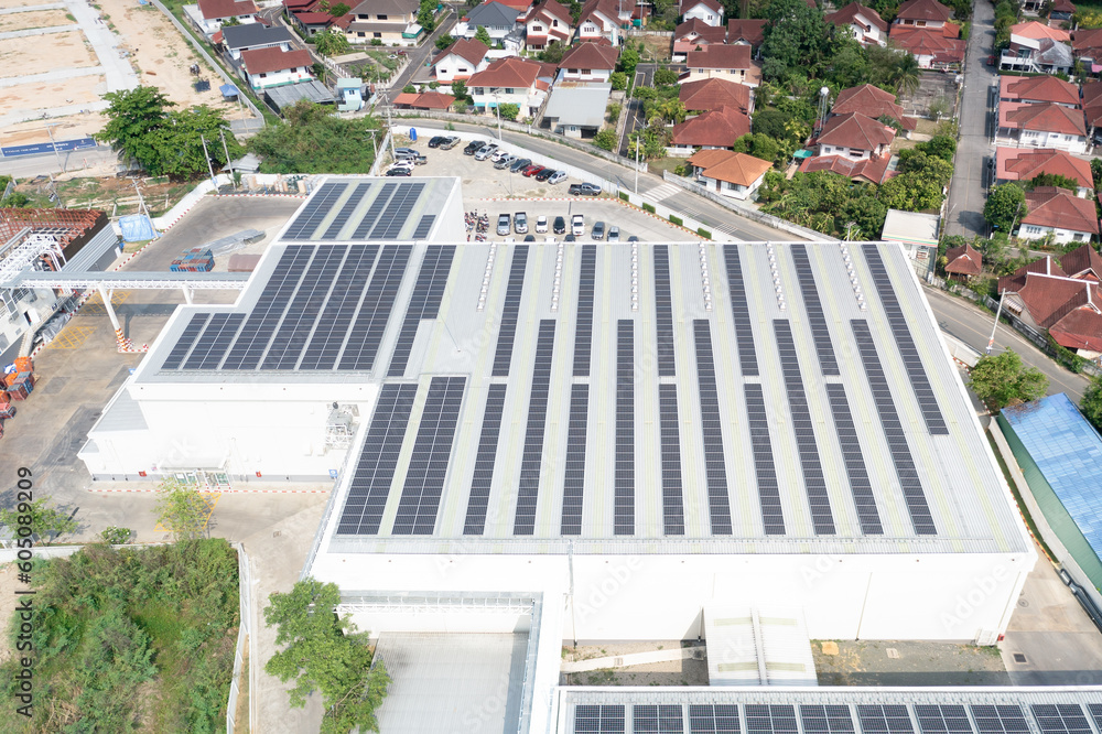 Wall mural eco building, shopping center in aerial view. solar cell or photovoltaic cell in panel on top of roo