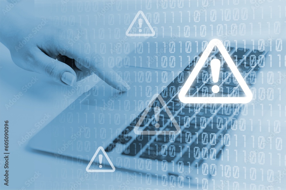 Aufkleber cyber security. man works on computer with alert sign