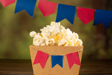 Popcorn in a Festive Setting with Hanging Banners (Brazilian Festa Junina)