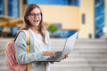 Fototapeta premium Happy young student with laptop computer