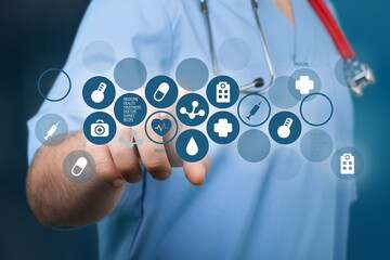 Medical doctor with digital hologram icons.