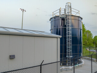 Fototapeta premium Photo of a blue steel, metal, industrial water tank, industries, commercial, municipal. 