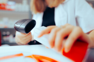 Pharmacist Scanning the Bar Code of a Product in the Drugstore. Vendor using a digital reader to make the checkout transaction

