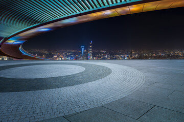 Round square floor and bridge with urban skyline in Shanghai, China.