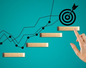 Human hand with wooden block and target icon.