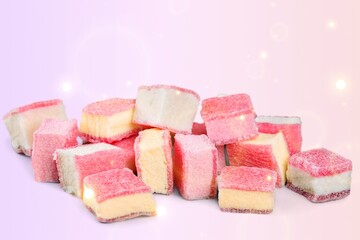 Tasty sweet colored gummies on background