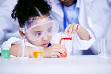 Science, research and child doing a experiment in a lab in physics or chemistry class in school. Knowledge, education and girl kid student working on a scientific project with glass beaker and liquid