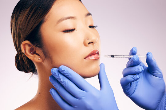 Lips injection, skincare and woman with plastic surgery in studio isolated on a white background. Cosmetics, syringe and female model with lip filler for dermatology, facelift treatment and beauty.
