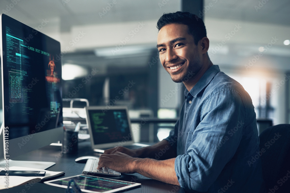 Poster Portrait, man and smile of programmer on computer in office workplace at night. IT, face and male coder or person programming, coding and writing for software development or information technology.