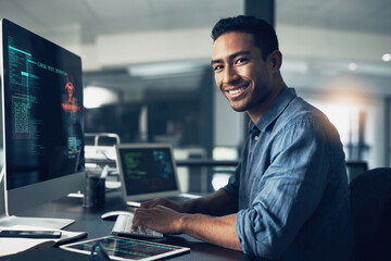 Portrait, man and smile of programmer on computer in office workplace at night. IT, face and male coder or person programming, coding and writing for software development or information technology. - obrazy, fototapety, plakaty