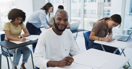 Black man, student portrait and university class with learning for college test. Book, school study and African male person thinking, writing and planning lecture notes for studying with a smile