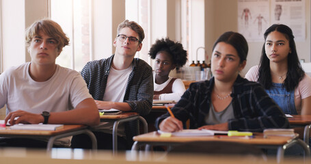 Education, college and students sitting in a classroom for learning, studying or future development. School, university and scholarship with a group of pupils in class lecture together to learn