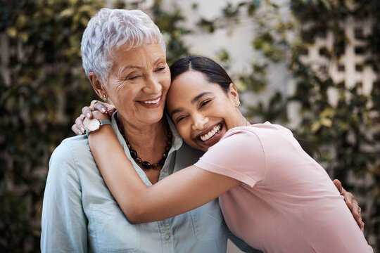 Happy, hug and portrait of a mother and woman in a garden on mothers day with love and gratitude. Smile, family and an adult daughter hugging a senior mom in a backyard or park for happiness